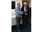 Bill Power, builder of the RNLB Har Lil, carriage and tractor, collecting one of his awards.